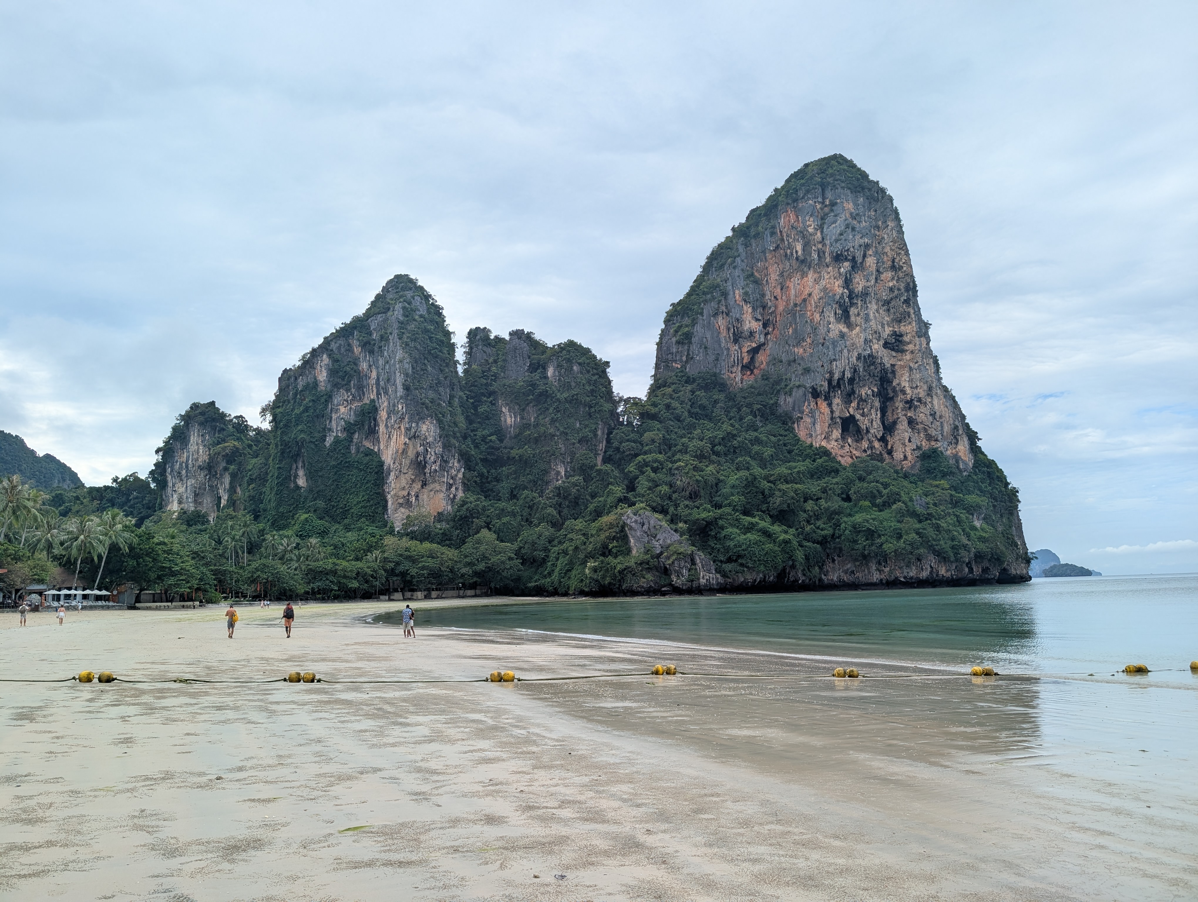 Railay Beach with limestone cliffs.
